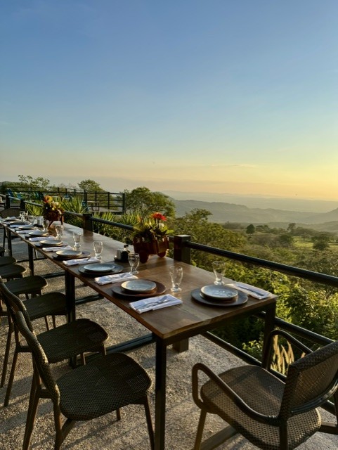 A communal dinner at sundown in Costa Rica &mdash; the cohort gathered around the table as the day closes.